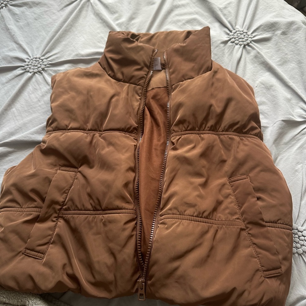 Divided Chocolate Brown Puffer Vest with a stain